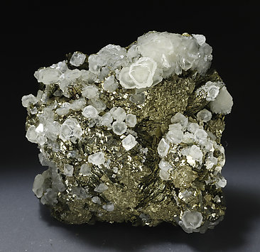 Pyrite with Marcasite, Calcite and Muscovite. Photo: Joaquim Calln