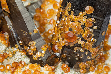 Spessartine with Quartz (variety smoky), Feldspar and Mica