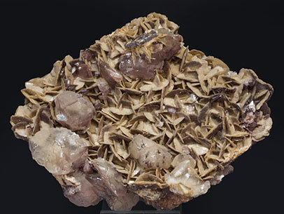 Calcite with Siderite, Dolomite and Hematite. 