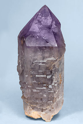 Quartz (variety amethyst) on Quartz (variety smoky) and Microcline. Front