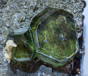 Fluorapatite with Ferberite, Siderite and Muscovite. 