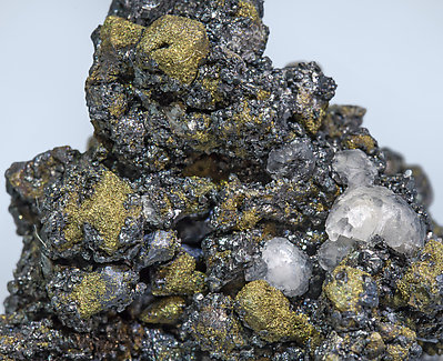 Acanthite (Se-bearing) with Polybasite (Se-bearing) and Calcite. 