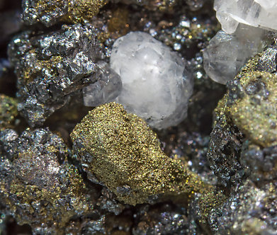 Acanthite (Se-bearing) with Polybasite (Se-bearing) and Calcite. 