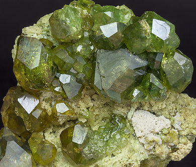 Andradite (variety demantoid) with Calcite. 