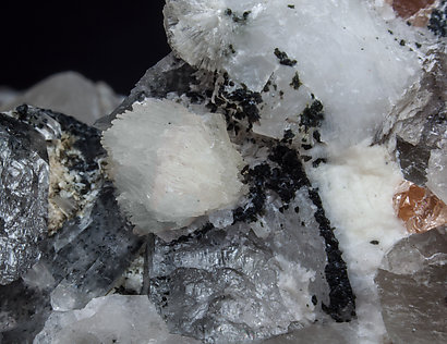 Bavenite with Quartz (variety smoky), Helvine and Feldspar. 