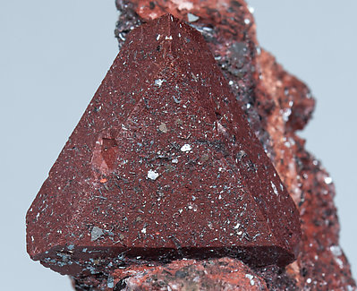 Zunyite with Hematite. 