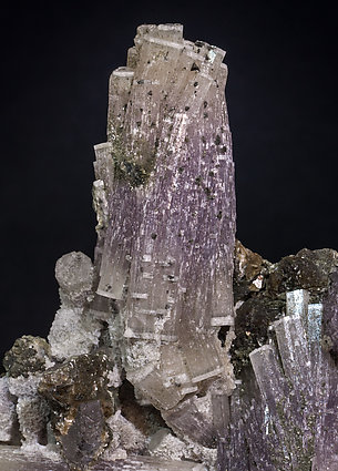 Fluorapatite with Muscovite, Chlorite, Quartz and Arsenopyrite. 