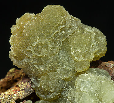 Austinite coated by white Adamite. 