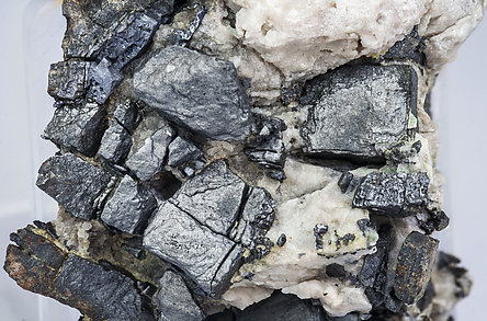 Ullmannite (As-bearing) with Calcite. 
