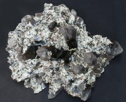 Bertrandite with Quartz (variety smoky) and Pyrite. Top