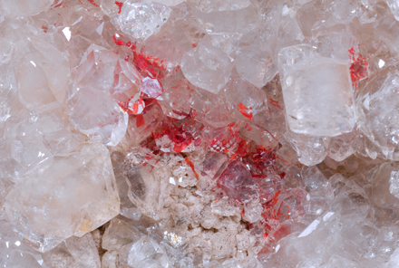 Colemanite with Realgar inclusions. 