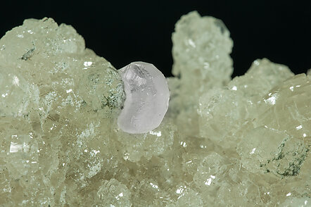 Prehnite with Calcite, Quartz (variety smoky) and Clinozoisite-Epidote (Series). 