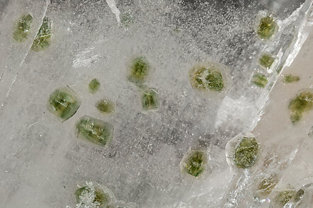 Quartz with Fluorapatite inclusions, Cassiterite and Siderite. 