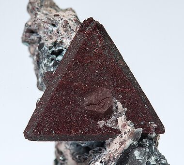 Zunyite with Hematite. 