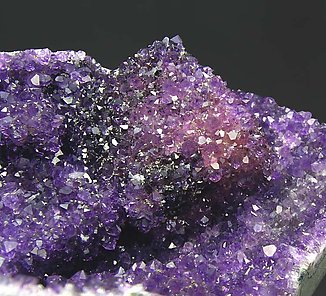 Calcite with Quartz (variety amethyst) and Hematite. 