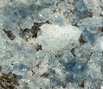 Fluorapatite with Bertrandite, Albite, Muscovite and Quartz. 