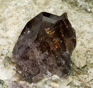 Axinite-(Fe) with Quartz and Calcite. 