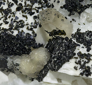 Bavenite with Microcline, chlorite and Quartz. 