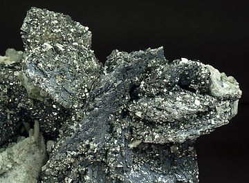 L�llingite with Molybdenite, Calcite, Arsenopyrite, Fluorite and Quartz. 